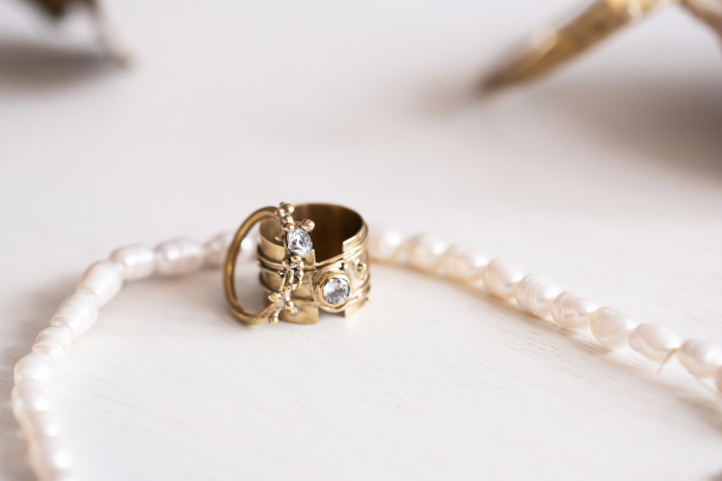 Wide Granulated Band with Faced Stone
