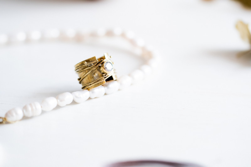 Wide Granulated Band with Faced Stone